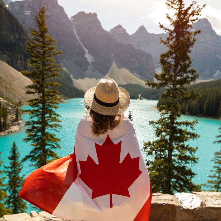 WOMAN WRAPPED IN A CANADIAN FLAG